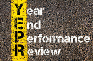 Concept image of Business Acronym YEPR YEAR END PERFORMANCE REVIEW written over road marking yellow paint line.